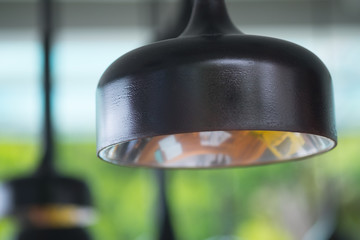 Black decorative lamp hanging from the ceiling