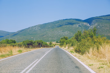 Greek Republic. Way and mountains, grass and trees. 13. Sep. 2019
