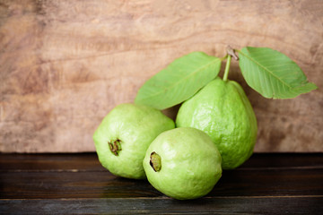 Fresh guava fruit on wooden background