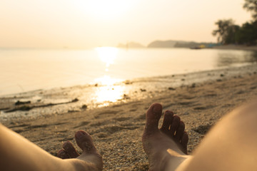 feet woman relaxing on the beach.