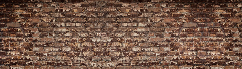 Wide red shabby brick wall texture. Old masonry large backdrop. Peeled orange brickwork long retro grunge background