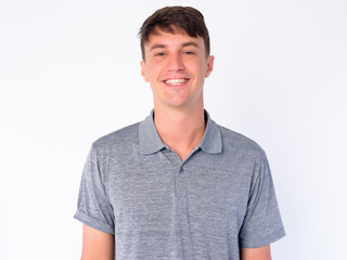 Face of happy young handsome man smiling