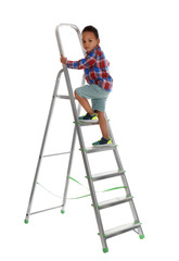 Little African-American boy climbing up ladder on white background. Danger at home