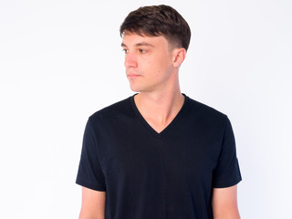 Fototapeta premium Face of young handsome man thinking and looking away