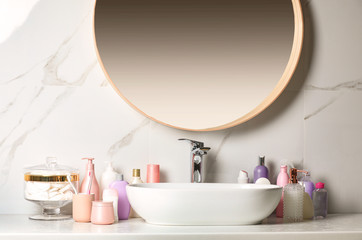 Obraz na płótnie Canvas Stick deodorant and different toiletry on countertop in bathroom