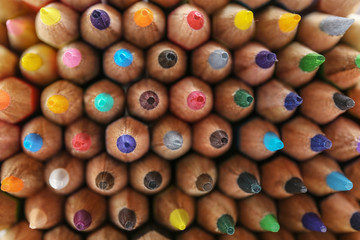 Different color pencils as background, closeup view