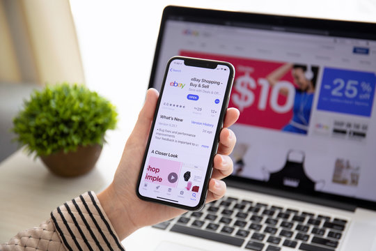  Woman Holding IPhone X With Internet Shopping Service EBay