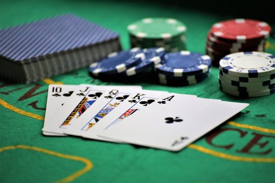 poker chips and cards on white background