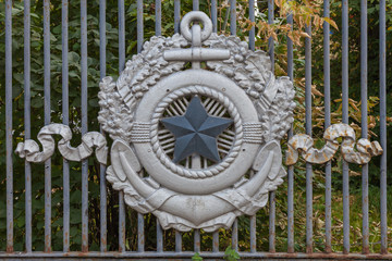 MOSCOW, RUSSIA, - September 20, 2019: The coat of arms of the Russian Navy is attached to the fence...