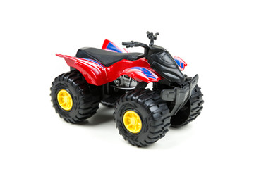 Red toy plastic quad atv on a white background © ecummings00
