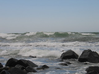 Sea, small wave, cloudy sky