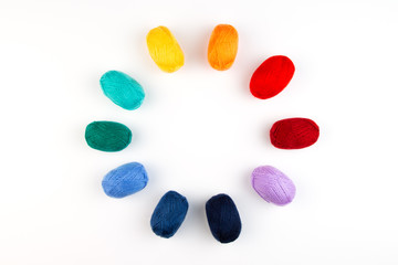 Fototapeta na wymiar Colorful balls of wool in a circle.