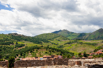 The view from the fortress on the hills under dark clouds
