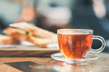 cup of tea at a cafe blurred background and garlic bread.