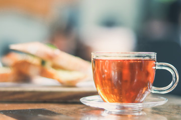 cup of tea at a cafe blurred background and garlic bread.