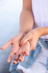 woman suffering from trigger finger, cps or carpal tunnel syndrome, gout desease, arthritis...