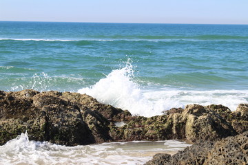 waves crashing on rocks