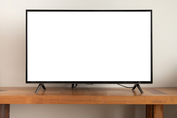 blank screen television on wooden table at living room.