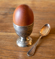 silver egg cup and egg