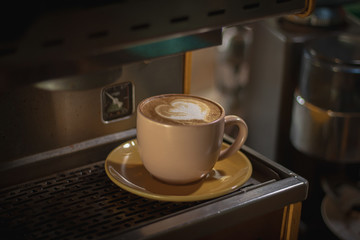 Latte art on the coffee machine at the coffee shop.