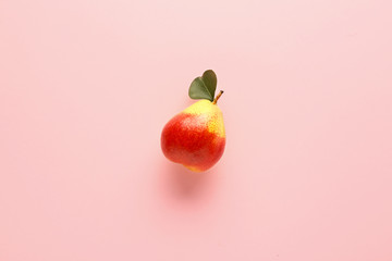 Sweet ripe pear on color background