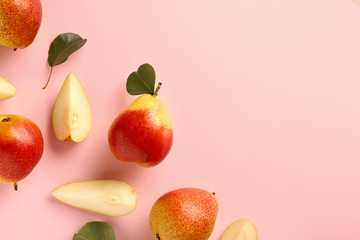 Sweet ripe pears on color background