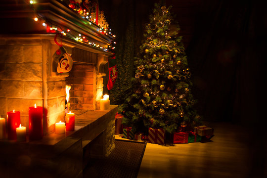 Christmas decorated living room interior with fireplace and xmas tree