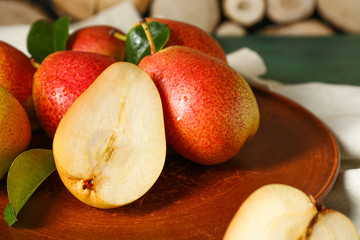 Tasty fresh pears on plate, closeup