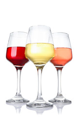 Glasses of different wine on white background