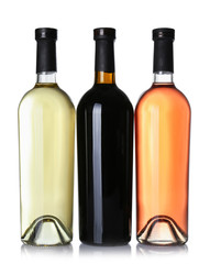 Bottles of different wine on white background