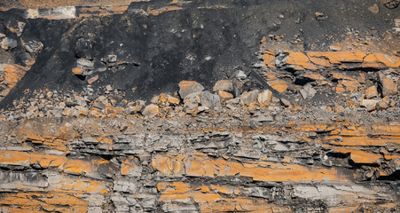 Geological section of soil, layers of coal. Overburden open mine anthracite. Consequences after rock explosion