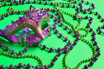 Carnival mask with decor on color background