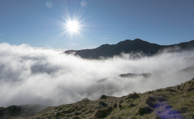 Cloud inversion weather with Mount Snowdon above the clouds, Wales UK
