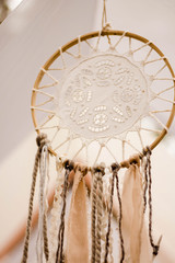 dreamcatcher on the background of a pine forest