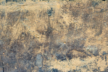 Texture of a concrete wall with cracks and scratches which can be used as a background