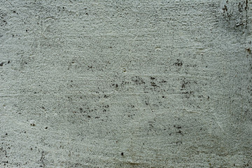 Texture of a concrete wall with cracks and scratches which can be used as a background