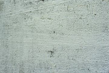 Texture of a concrete wall with cracks and scratches which can be used as a background