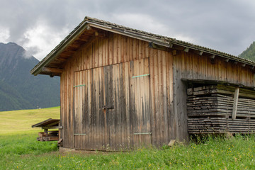 Fototapeta na wymiar Wooden barn in a valley in Austria 