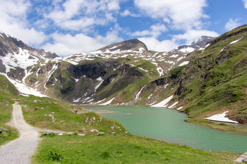Naklejka na ściany i meble A small glacial lake in the Alps