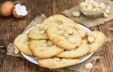 Some fresh Cookies on wooden background (selective focus; close-up shot)