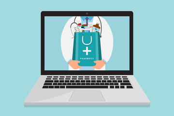 Online pharmacy. doctor with medicine bag inside laptop