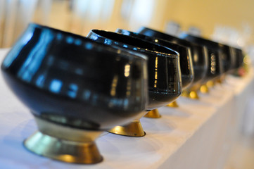 Monks arranged in alms bowls