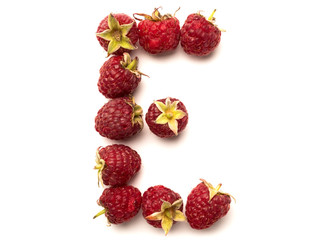 Isolated alphabet letter lined with fresh raspberries