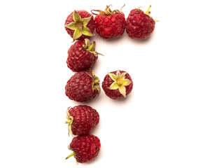 Isolated alphabet letter lined with fresh raspberries