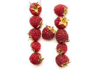 Isolated alphabet letter lined with fresh raspberries