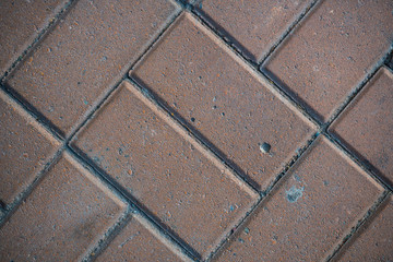 Texture of paving slabs overgrown with grass. Background image of a stratum stone