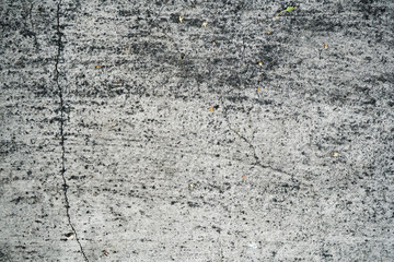 Obraz premium Texture of an old cracked concrete wall. Background image of a worn gray concrete surface