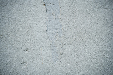 Texture of an old wall covered with paint. Background image of a worn paint coated surface