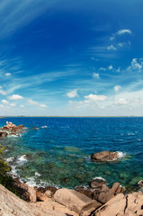 Beautiful seascape with clear water and blue sky with clouds. Sri Lanka.