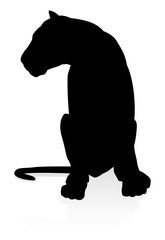 A female lion or other big cat safari animal in silhouette